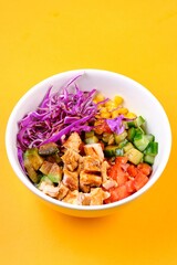 Chicken Salad Bowl on a Yellow Background