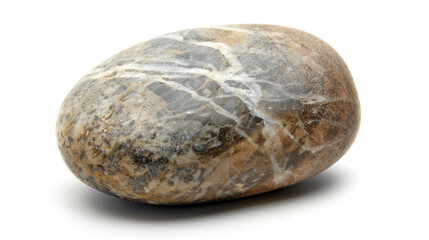 Rock with white and brown pattern, resting on sandy beach with blue ocean in background, under clear blue sky.