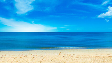 Nature of the beach and sea Summer with sunshine, sandy beaches, clear blue waters sparkling against the blue sky. On an island with good ecology and environment Background for summer vacation concept