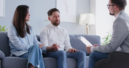 Family psychotherapy session, with a psychologist provides support and help to a family couple. They engage in a conversation, receiving advice and guidance to improve relationship and mental health.