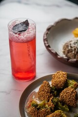 Plate of Fried Broccoli with Red Lemonade