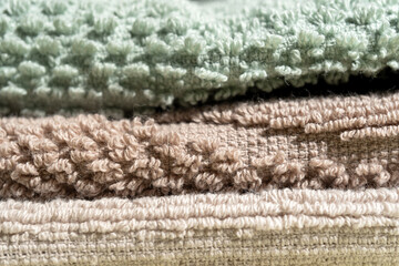  Mocha Mousse Folded cotton towels in a pile