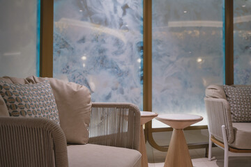 Thermal suite with heated loungers in mosaic tile design or relaxation chairs in spa or wellness...