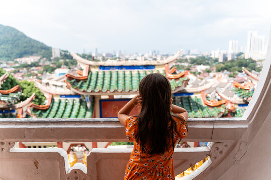 Girl overlooking Penang city from  Kek Lok Si Temple, Malaysia