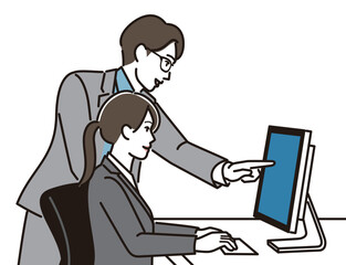 PCの前で打ち合わせする男女