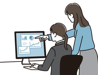 PCの前で打ち合わせする女性