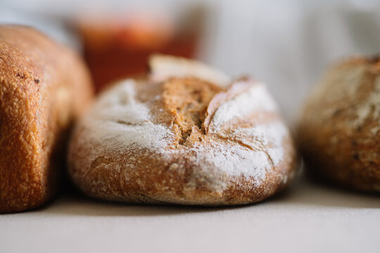 Golden crusted artisanal bread in a woven wicker basket.