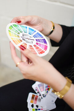 Hands holding a color palette circle