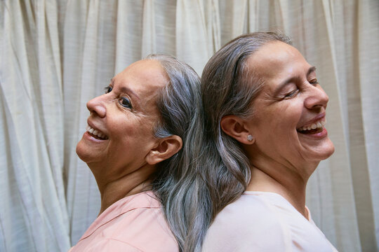 Joyful Senior Women Back-to-Back
