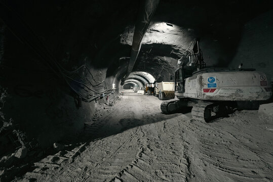 excavator excavating in subway tunnel construction