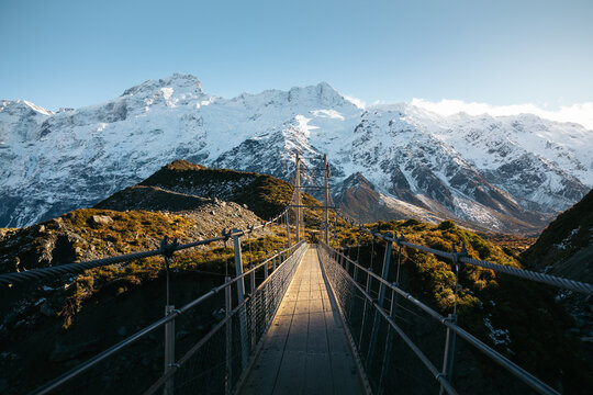 Swing bridge with views to snowy mountains