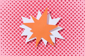 Abstract Paper Art With Orange Starburst On Pink Polka Dot Background