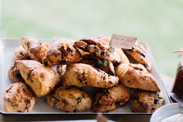 Tray of freshly baked scones displayed on the table