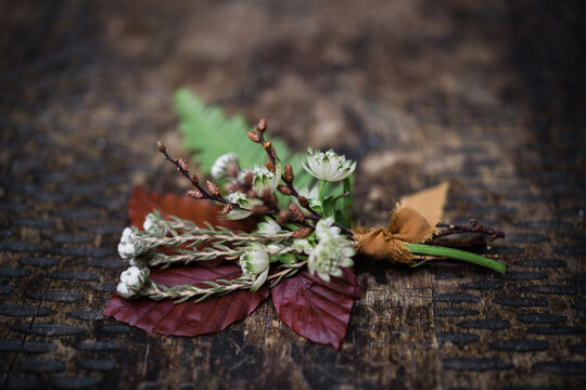 Rustic bouquet with ferns and white blossoms