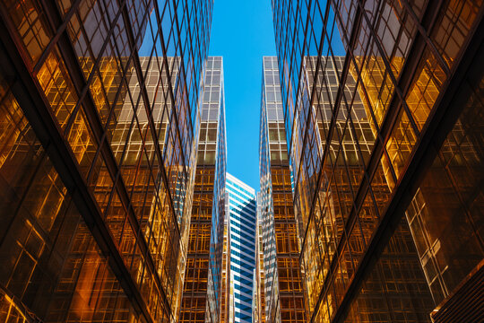 Modern Glass Buildings with Reflections and Geometric Patterns