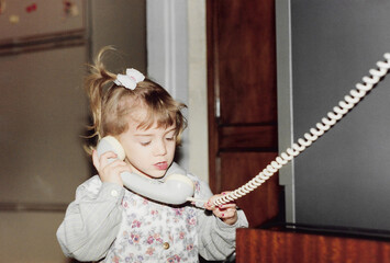 Girl using old fashioned telephone