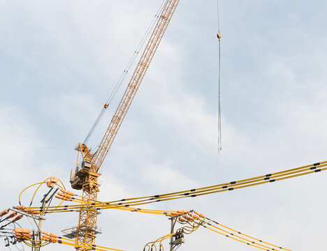 Yellow crane and electric wire