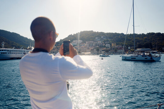 Man takes photos on the coast