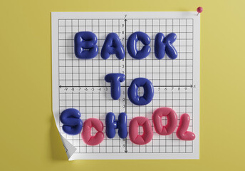 Colorful foam letters spell back to school on a graph paper background