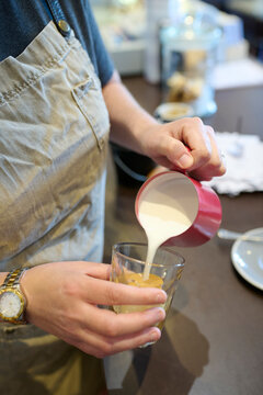 Pouring Fresh Milk Into a latte