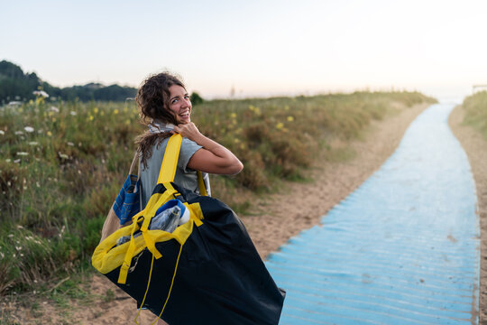 Happy woman walking to the beach.