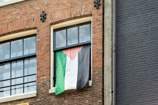 The Palestinian flag flies in the window
