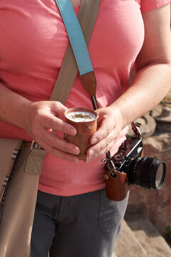 Tourist holding cup of lassi drink in Varanasi