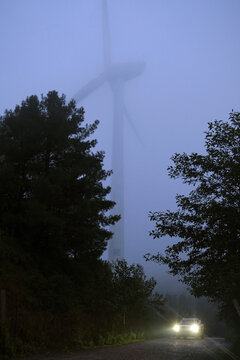 Wind turbines in heavy fog, on high mountains in the plateau