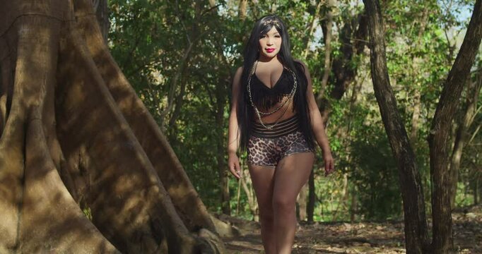 In a tropical park on the Caribbean island of Trinidad, a woman in shorts enjoys the atmosphere.