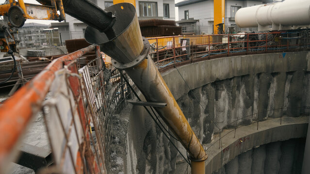 Concrete delivery from concrete mixer at well construction