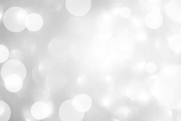 Background grey bokeh abstarct white beige circle light texture bubble blur pattern defocused glowing sparkle snow glitter snowflake magig backdrop ecosystem foreground card silver space decoration.