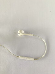 white earphones with plus and minus button options