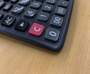 Fototapeta premium calculator on the table with numbers in white