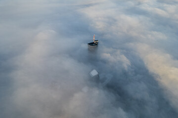 Aerial autumn morning view of skyscraper in fog, Vilnius, Lithuania