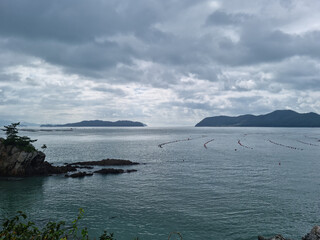 
It is a seascape of Land’s End Village covered in dark clouds.