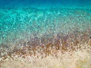 Tropical ocean water abstract texture background with sea surface, wave and beach in Indonesia