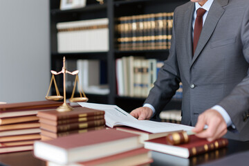 judge reviewing case file, law books visible in background office