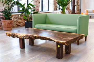 a live edge wooden coffee table with dark brown wood and natural edge, with surface scratches and marks