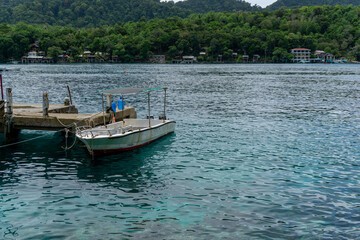 Fototapeta premium Tourist and divers boat at the dock in Rubiah Island Sumatera, Indonesia. Two fishing boats at the harbour in Sabang Island.