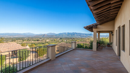 Stunning mountain view from a spacious terrace overlooking a serene landscape in a sunny location