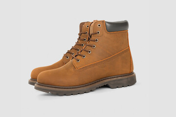 Brown leather boots on white background. Fashion 