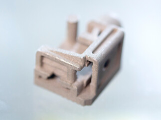 Object printed on 3D printer from metal powder using Metal Jet technology. High detailed detailing parts. Metal Jet. 3D-printed metal parts. Modern 3D printing, additive manufacturing technologies