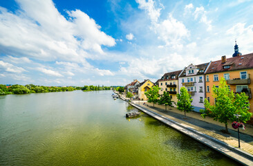 Obraz premium View from the Old Main Bridge of the Main and the city of Kitzingen. Medieval stone bridge of the city.
