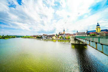 View of the Main and the Old Main Bridge in Kitzingen. Medieval stone bridge of the city.
