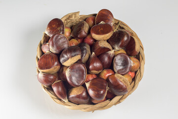 Basket of Chestnuts with Autumn Leaves