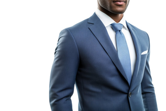 A professional man dressed in a tailored suit with a light blue tie, conveying confidence and elegance against a white background.