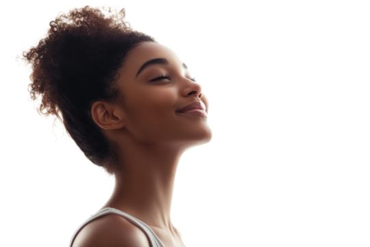 A serene profile portrait of a young woman with curly hair enjoying a moment of tranquility against a white background.