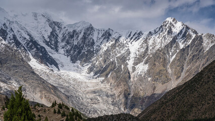 Scenic landscape view of Chongra glacier and snow-capped mountains near Tarishing village, Astore, Gilgit-Baltistan, Pakistan