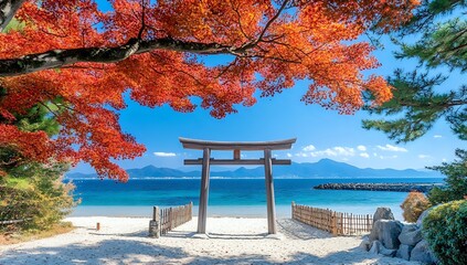 Stunning view of a traditional Japanese Torii gate on a sandy beach with red maple leaves framing...