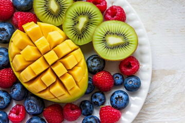 Bright and fresh fruit salad, expertly arranged on a snow-white background